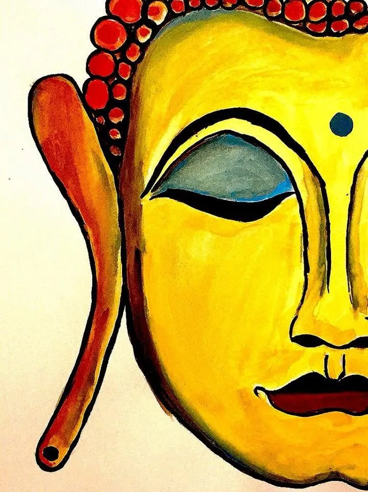 A close-up of the Buddha’s serene face in yellow, eyes closed
